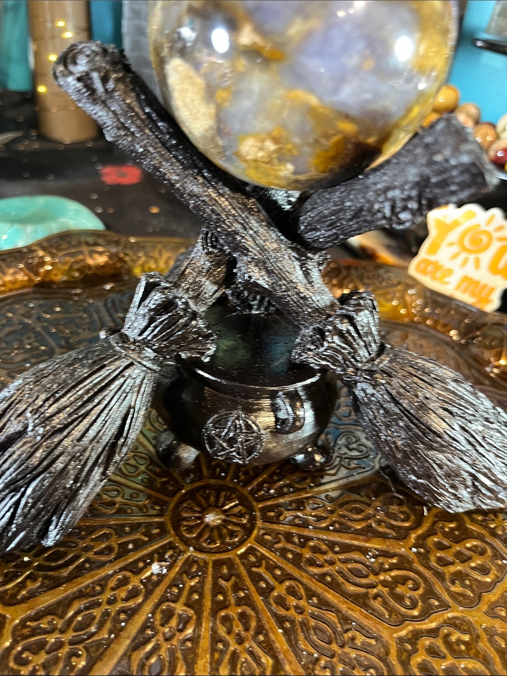 Broom and cauldron sphere holder